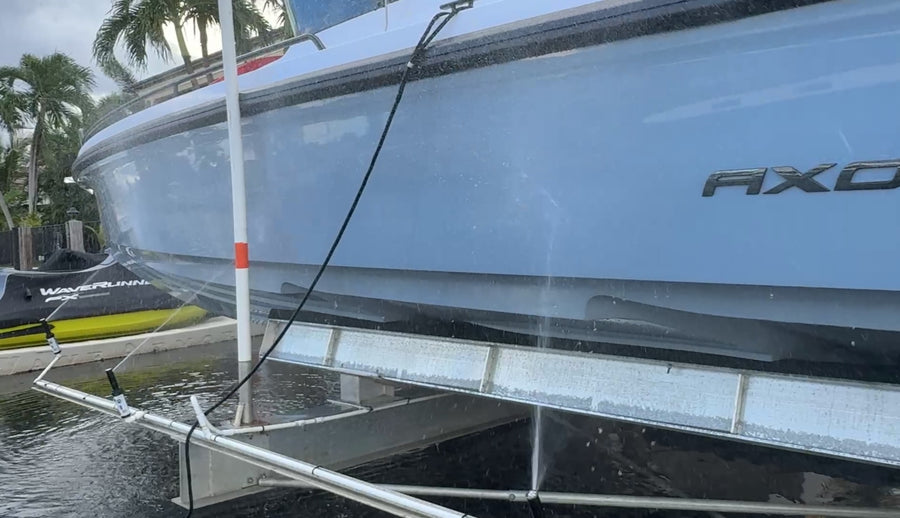 LiftWash rinsing a boat hull on its lift